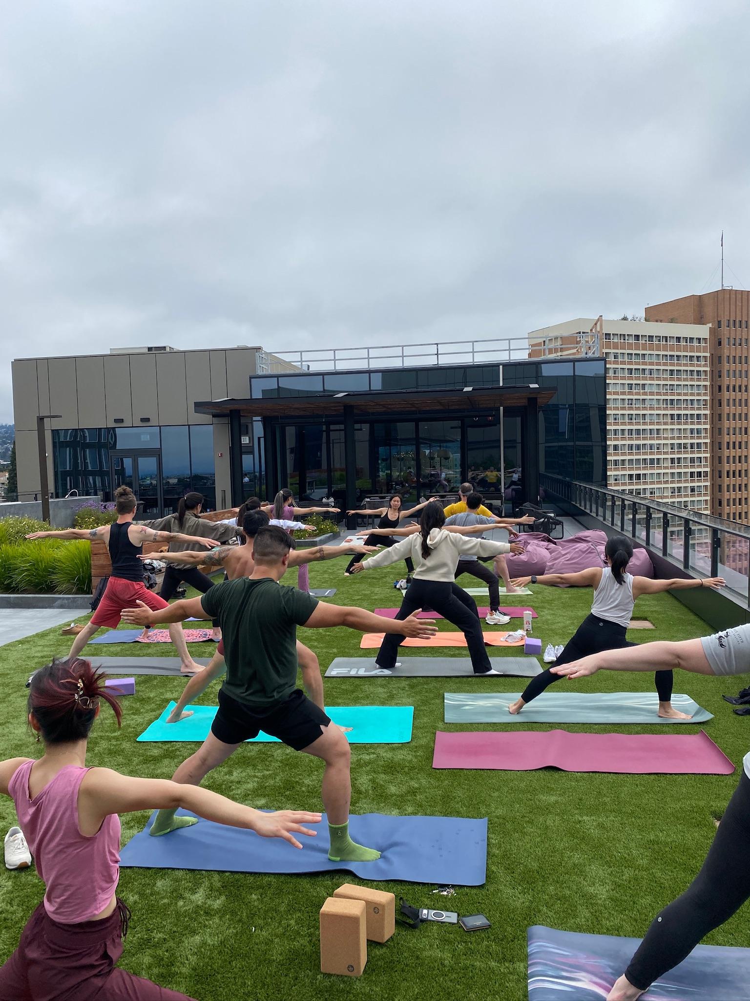 Outdoor rooftop yoga class community practice