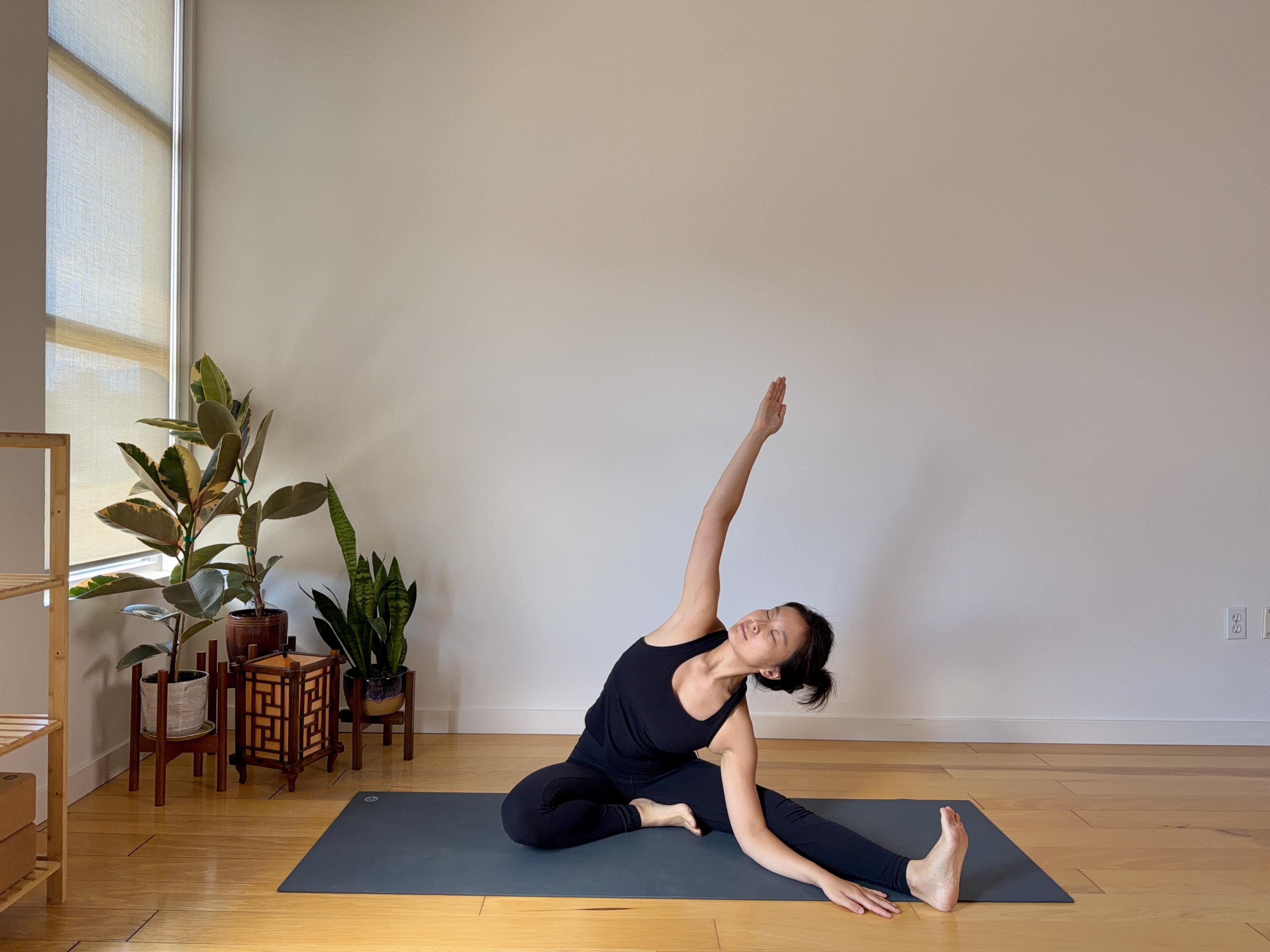 Sophia practicing yoga in a calm setting for the free 5-day yoga guide.